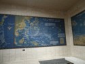 Maps on the wall show the history of the war